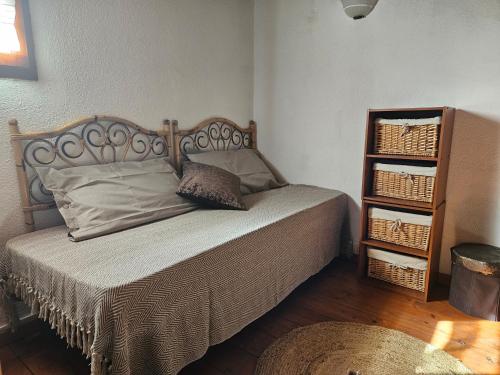 a bedroom with a bed and a book shelf at Casa Margherita in Trudda