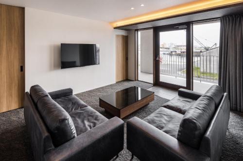 a living room with two couches and a tv at Hotel Dios - Vacation STAY 31184v in Awaji