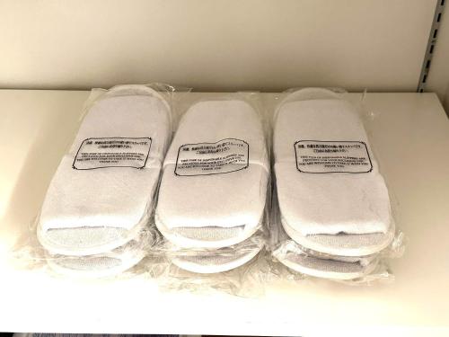 three folded towels sitting in a box at Hotel Dios - Vacation STAY 31184v in Awaji