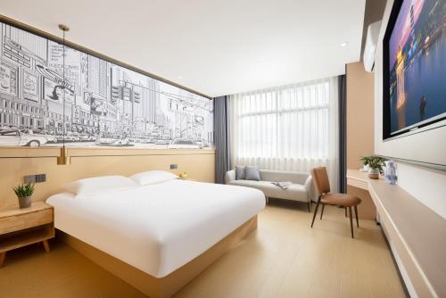 Postelja oz. postelje v sobi nastanitve MISONG Light Residence Design Hotel - Shangrao Wuyuan Landscape Bridge