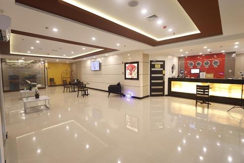 a large lobby with a dining room and a kitchen at Hotel Sogo Avenida in Manila