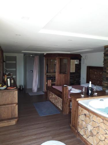 a bathroom with a bath tub and a sink at Haloze ForMe in Zavrč