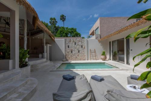 a villa with a swimming pool and a house at Cielo Boutique Hotel & Spa Samui in Bophut 