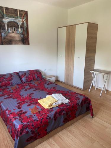 a bedroom with a bed with a dresser and a mirror at Casa Blanca in Techirghiol