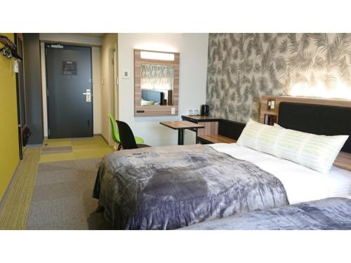 Giường trong phòng chung tại Green Rich Hotel Okinawa Nago - Vacation STAY 49913v
