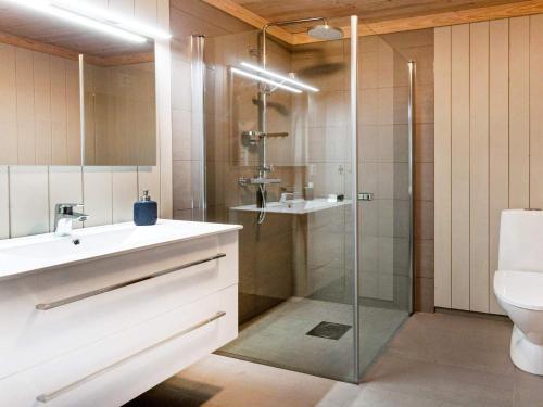 a bathroom with a shower and a sink and a toilet at 10 person holiday home in Fåvang in Strande