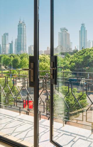 a view of a city from a window at Opartment - People's Square 远东饭店 - 人民广场 in Shanghai