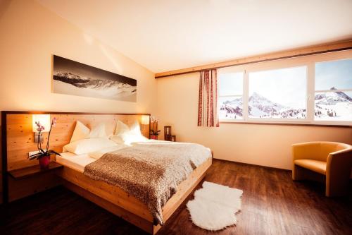 Postel nebo postele na pokoji v ubytování Hotel Alpenrose aktiv & sport