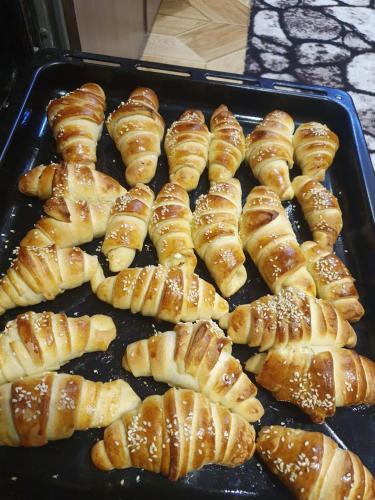 a tray of pastries on a baking sheet at Guest house Homely in Dushanbe