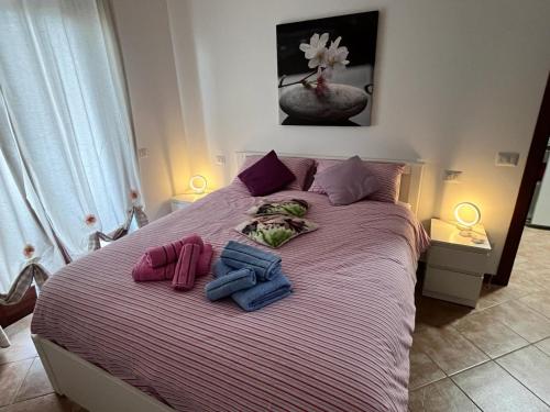 Ένα ή περισσότερα κρεβάτια σε δωμάτιο στο La Casina Azzurra