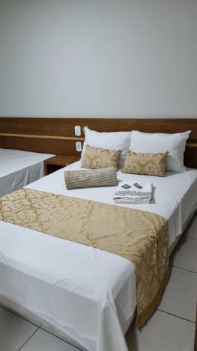 Posteľ alebo postele v izbe v ubytovaní HOTEL BEIRA RIO