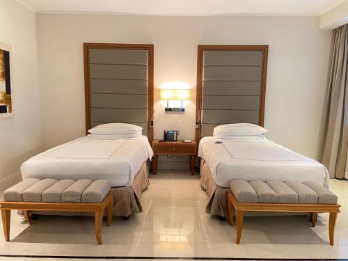 Voodi või voodid majutusasutuse Grand Hotel Djibloho toas