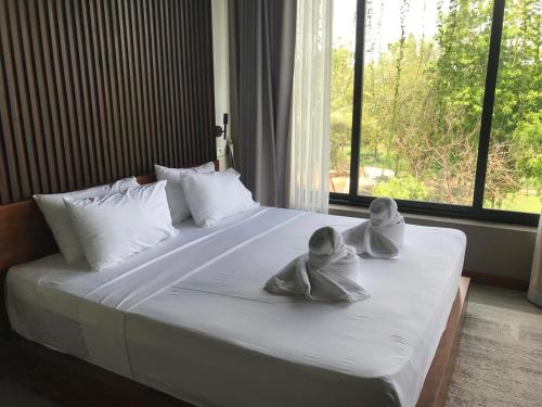 Postel nebo postele na pokoji v ubytování Thimbiri Wewa Resort Wilpattu