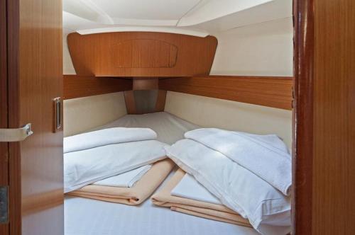 a small room with two beds on a boat at Bed on Boat 32021 corfu in Ágios Rókkos