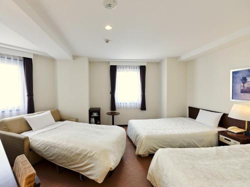 Postel nebo postele na pokoji v ubytování Hotel Courtland