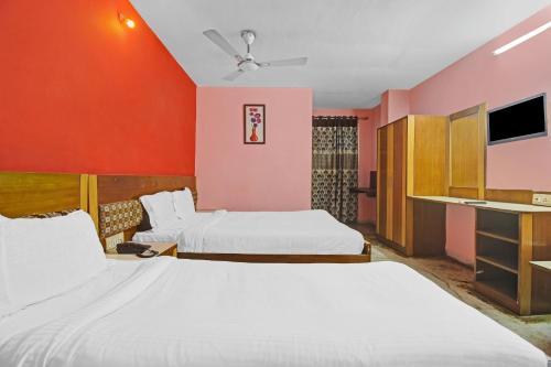 Ένα ή περισσότερα κρεβάτια σε δωμάτιο στο Hotel O Rahul International Hyderabad
