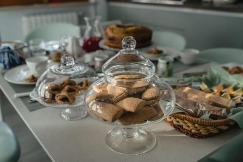 a glass jar filled with cookies on a table at B&B La Perla in Frosinone