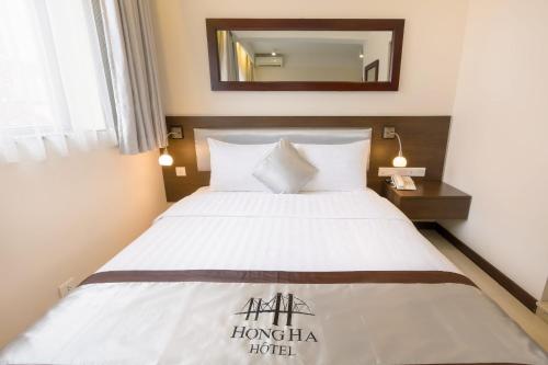 Postel nebo postele na pokoji v ubytování Hồng Hà Hotel HN - by BAY LUXURY