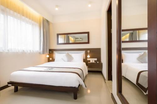 Postel nebo postele na pokoji v ubytování Hồng Hà Hotel HN - by BAY LUXURY