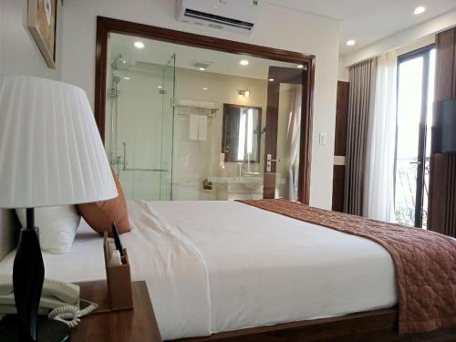 Postel nebo postele na pokoji v ubytování Catba View Hotel