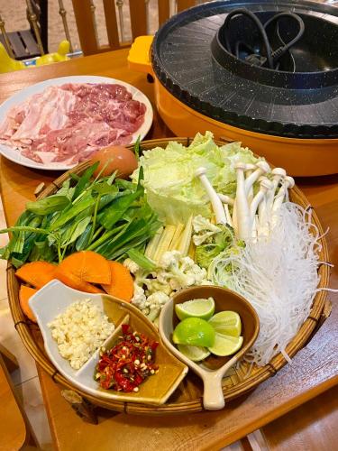 a tray of food with vegetables and other foods on a table at Rainbow Bungalow Haadrin Koh Phangan in Haad Rin