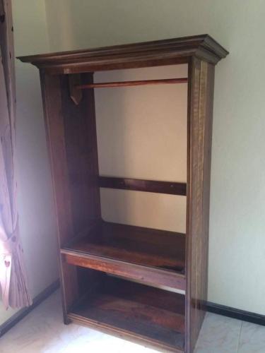 a wooden shelf in the corner of a room at Rainbow Bungalow Haadrin Koh Phangan in Haad Rin