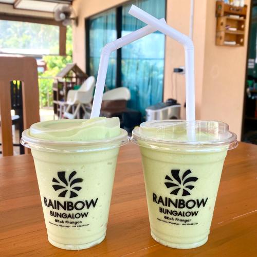 two drinks sitting on top of a table at Rainbow Bungalow Haadrin Koh Phangan in Haad Rin