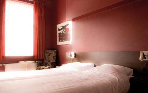 Postel nebo postele na pokoji v ubytování Hotel Bertram