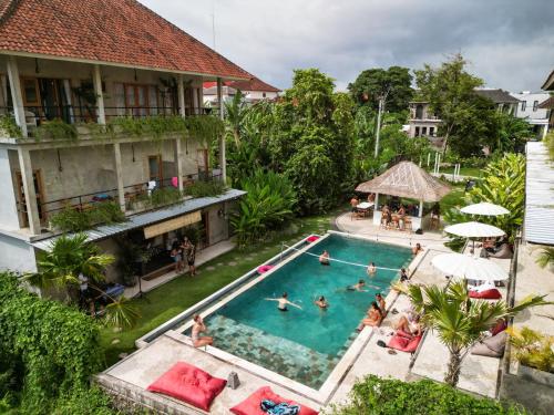 an overhead view of a pool at a resort at Sepeda Hostel in Canggu