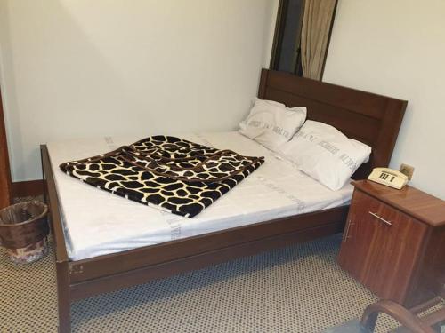 Кровать или кровати в номере Rehan Hotel