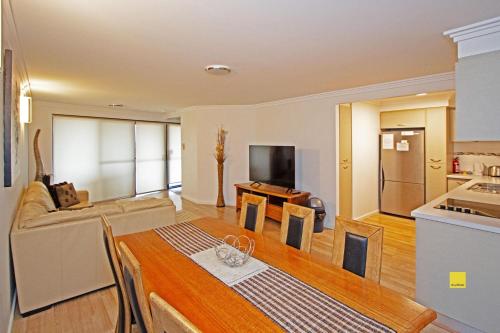 a kitchen and a living room with a table at Lesueur Days in Jurien Bay