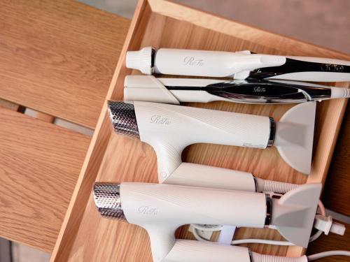 a wooden drawer filled with lots of hair tools at KONJAKUSO Nara Naramachi "MUSHIBUROYA" Sauna Villa in Nara