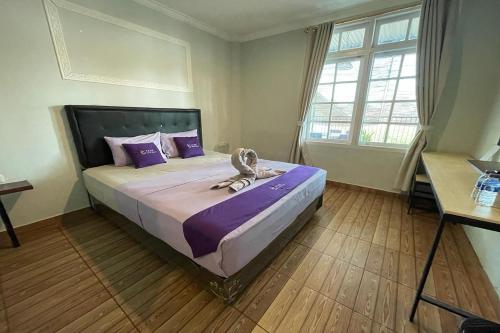 Ένα ή περισσότερα κρεβάτια σε δωμάτιο στο Take Guesthouse 2