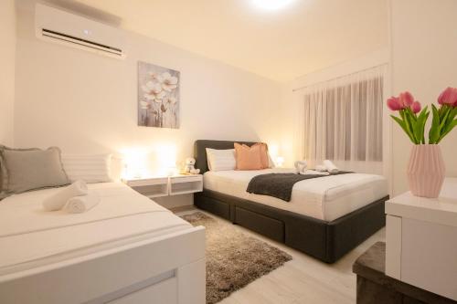 Ένα ή περισσότερα κρεβάτια σε δωμάτιο στο Green Oasis