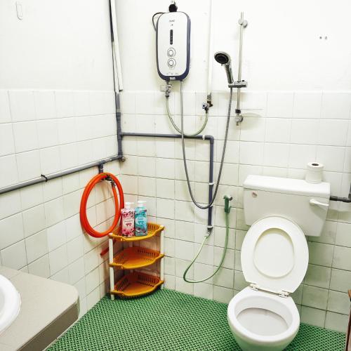 a bathroom with a shower and a toilet at Cheras Landed Homestay 4BR - 10Pax - MRT Suntex in Cheras