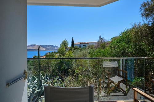 a room with a balcony with a view of the water at Aquarius Hotel in Kas
