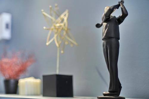 a toy figurine of a man playing a saxophone at Continew Residence KL CoBNB in Kuala Lumpur