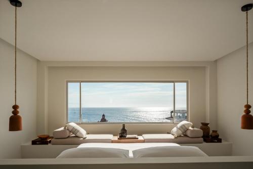 Postel nebo postele na pokoji v ubytování The Tryst Puerto Vallarta LGBT Hotel
