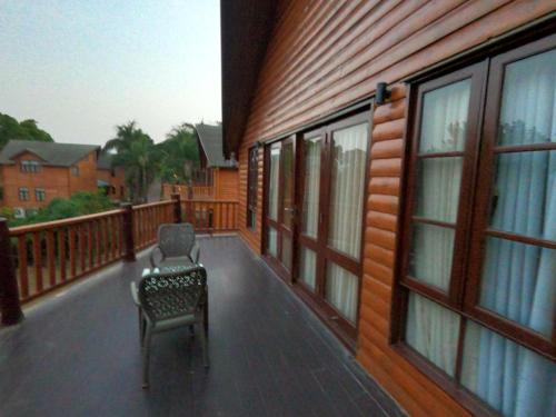 a chair sitting on the balcony of a house at Aamby Valley City in Lonavala