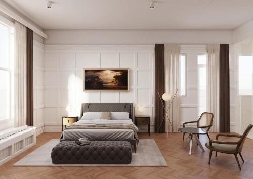 a bedroom with a bed and a table and chairs at Villa Ariston in Opatija