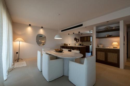 a kitchen with a white island in a room at OVILIO KALAMATA in Kalamata