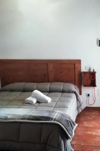 a bedroom with a bed with two towels on it at Country House Ca' Vernaccia in Urbino