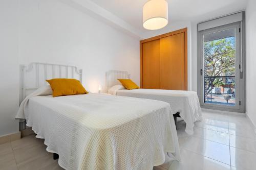 Ένα ή περισσότερα κρεβάτια σε δωμάτιο στο Hauzify I Apartament Mestral