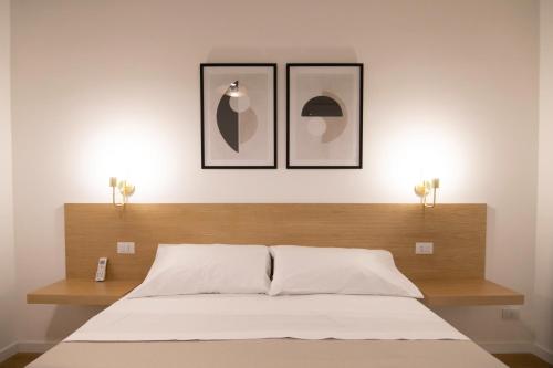 Кровать или кровати в номере Villareale47 Luxury Suites & Rooms