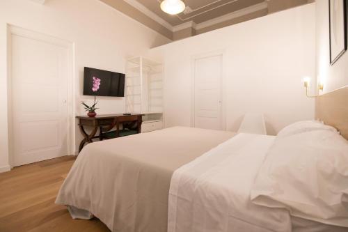 Кровать или кровати в номере Villareale47 Luxury Suites & Rooms
