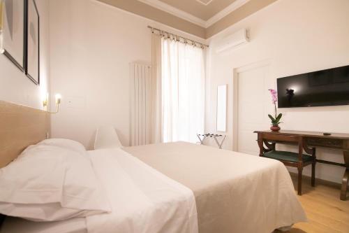Кровать или кровати в номере Villareale47 Luxury Suites & Rooms