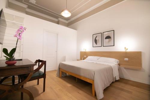 Кровать или кровати в номере Villareale47 Luxury Suites & Rooms