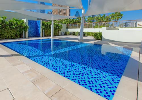 a swimming pool in the middle of a building at Downtown Views 4702 in Dubai