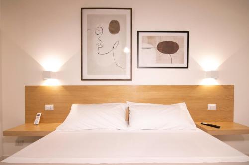 Кровать или кровати в номере Villareale47 Luxury Suites & Rooms