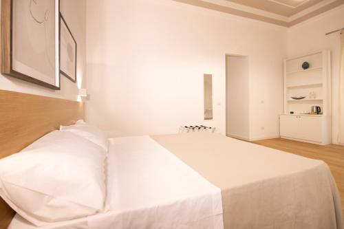 Кровать или кровати в номере Villareale47 Luxury Suites & Rooms